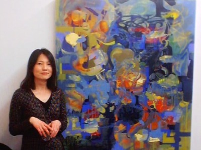 Keiko Fujimoto posing infront of her art.